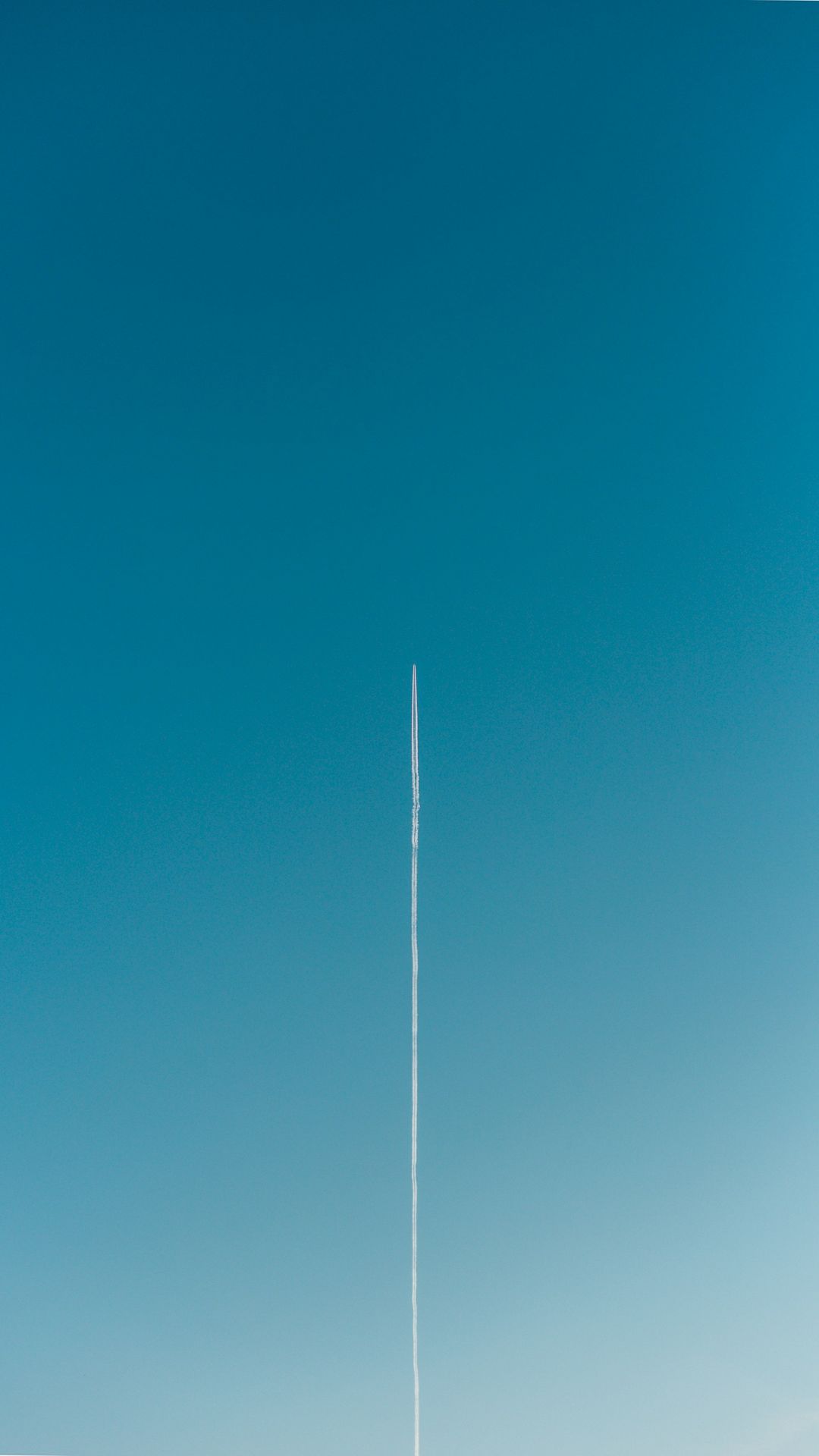 a plane is flying high in the sky